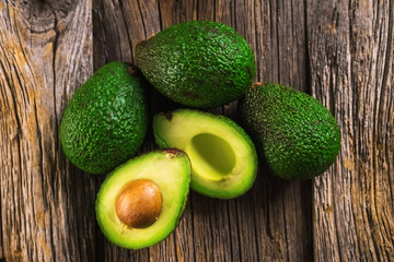 Avocados on wooden background © Daniel Vincek