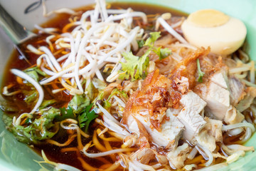 Crispy Pork noodles with egg in big bowl