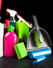 Cleaning supplies on black background