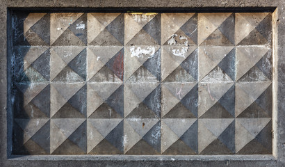 Background texture of old gray concrete fence with square pattern