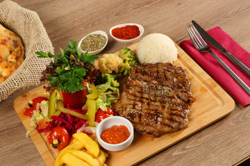 Delicious Beef Steak Meat on Wooden Restaurant Plate