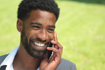 Beautiful businessman in the park