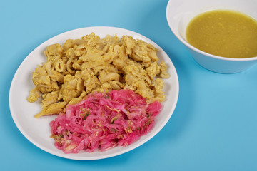 Whole-grain pasta with tofu on a blue