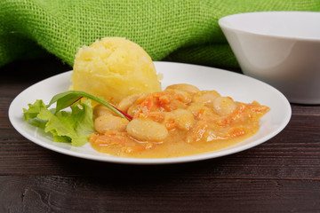 Beans with carrots and potatoes on a table
