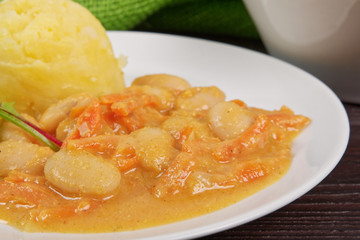 Beans with carrots and potatoes on a table