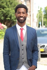 Naklejka premium Beautiful businessman in the park