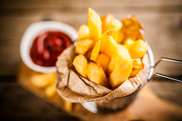 French fries on wooden table