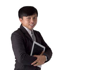 Fototapeta na wymiar Portrait Asia young man wearing suit holding tablet and smiling on white isolated background.