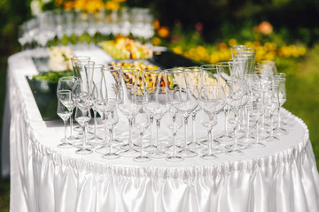 Served table for the event. Lunch in the open air. Summer terrace. Dinner.