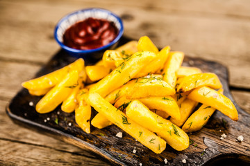 French fries on wooden table