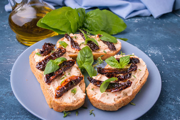 Bruschetta with cream cheese and dried tomato