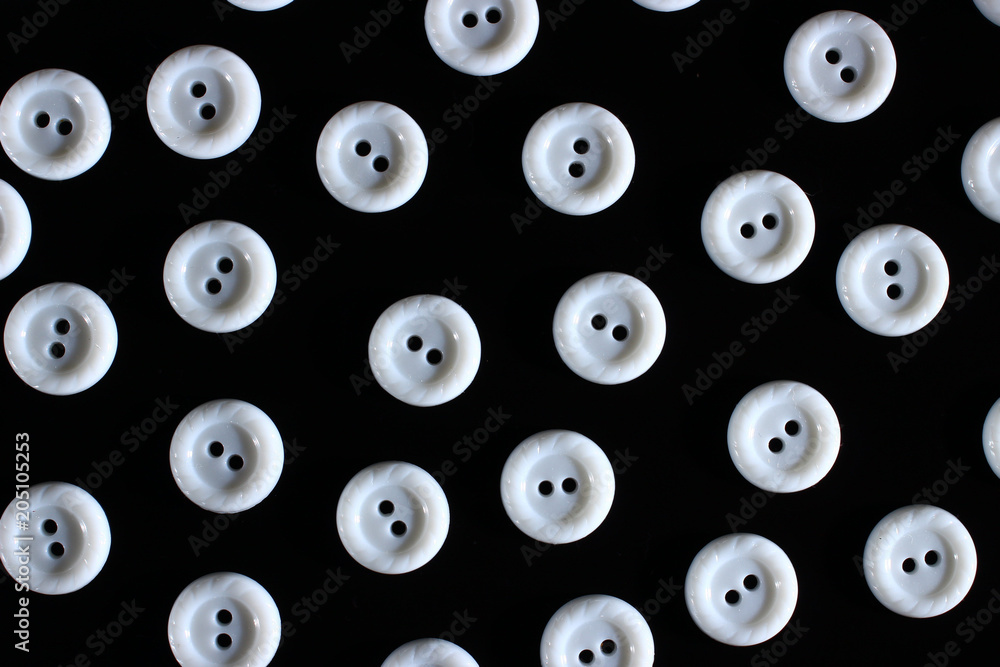 Poster white buttons on the dark background symbolize chaos