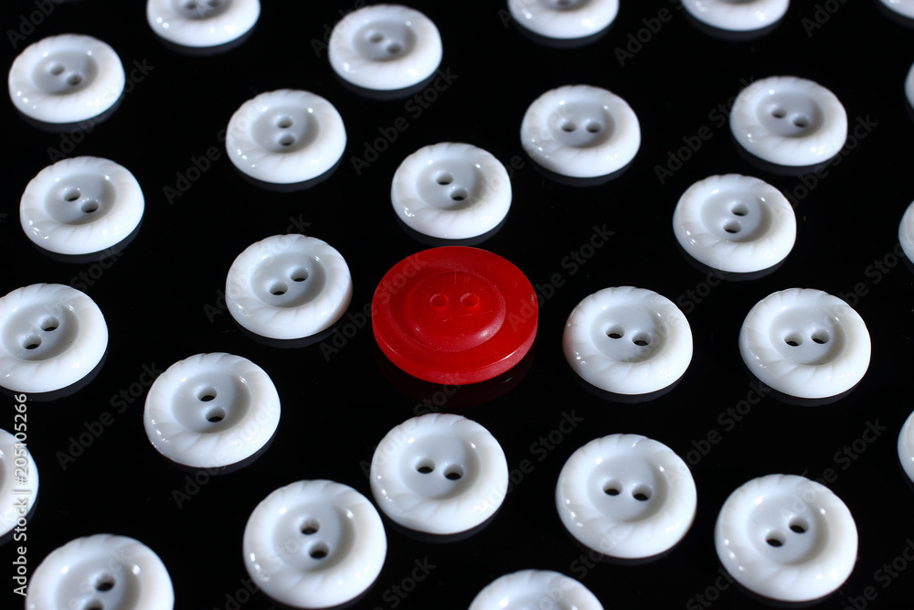 Poster white buttons on a dark background and someone else's button of another color