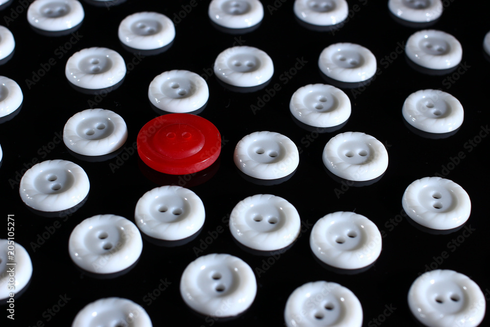 Poster white buttons on a dark background and someone else's button of another color