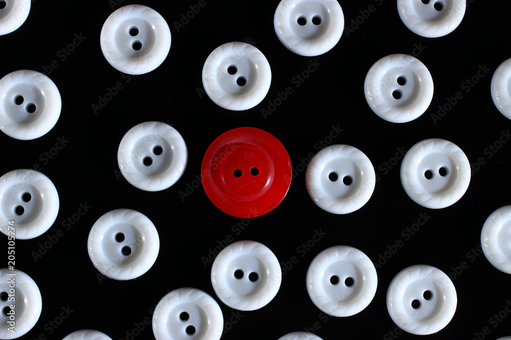 Poster white buttons on a dark background and someone else's button of another color