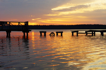 Fototapeta premium Sunset over the destroyed jetty, Masuria, Poland.