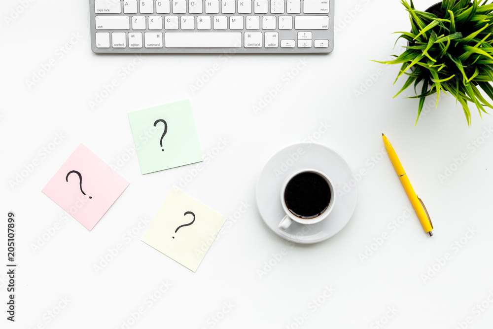 Poster question mark on sticky notes on office desk on white background top view. faq concept. working with