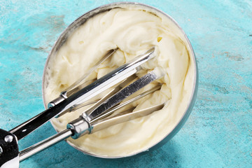 close up of a white whipped or sour cream in bowl.
