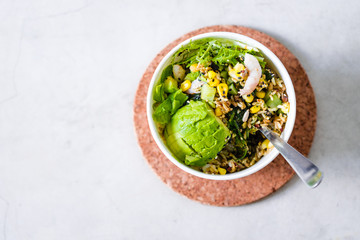 Take away salad in disposable white paper bowl on concrete background. Minimalism food photography concept. Flatlay, copyspace, horizontal