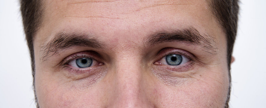 closeup of a man's bright blue eyes