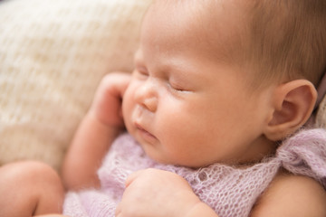A newborn baby is sleeping. Close-up, selective focus