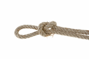 wicker rope tied in knot against white background