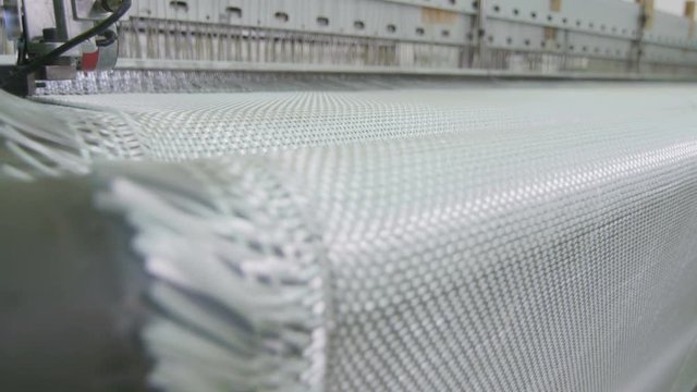 wide synthetic fabric linen moves from loom close view