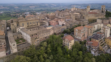 Fototapeta na wymiar Aerial view of the municipality of Osimo, in the province of Ancona, in the Marche region, in Italy. The historic center with its walls, roofs, squares is a mountain tourist destination.