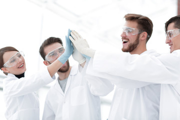 scientists giving each other a high five