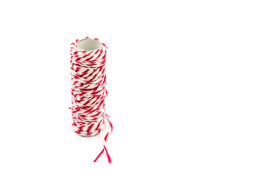 red and white yarn roll isolated on white background