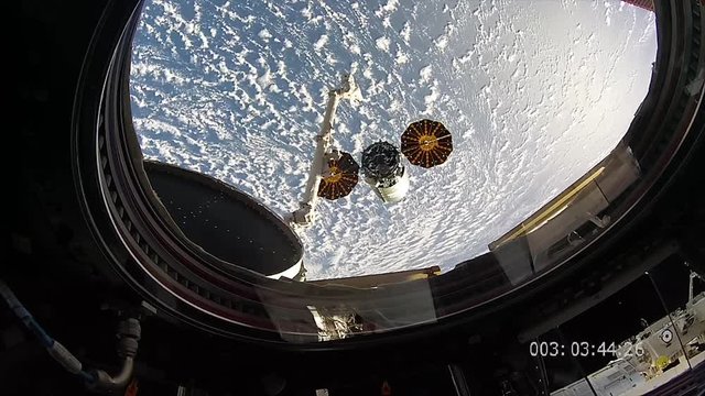 Window in ISS overlooking Earth, close up