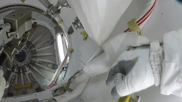 POV, astronaut works on International Space Station exterior