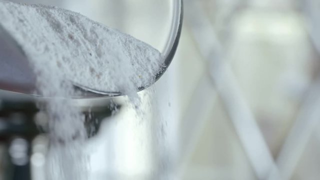 White laundry detergent pour out of buckets