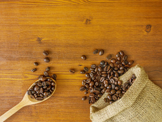 Flat lay coffee beans on wooden background with copy space