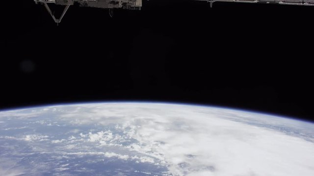 Tilt down, International Space Station above Earth