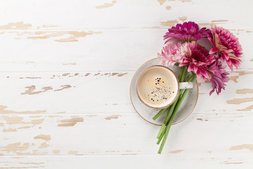 Obraz na płótnie Canvas Coffee cup and gerbera flowers