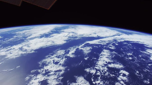 Wide, International Space Station flying over ocean