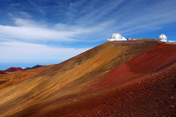 Observatories on top of Mauna Kea mountain peak. Astronomical research facilities and large telescope observatories located at the summit of Mauna Kea on the Big Island of Hawaii, USA