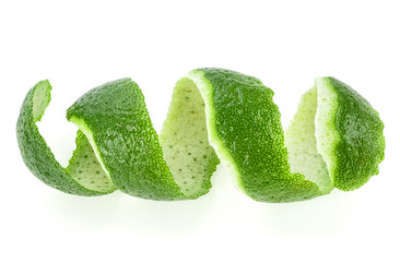Peel of lime isolated on white background, closeup.