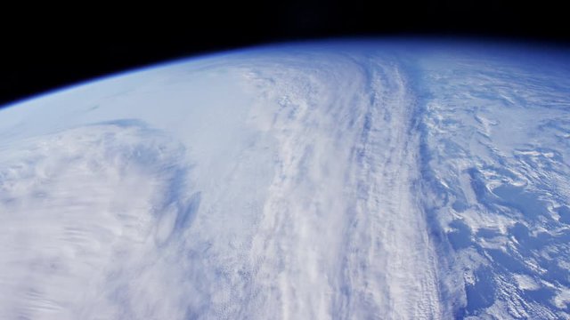 Wide, International Space Station flies over Earth