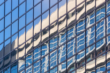 City landscape - view from below on glass skyscrapers with reflected sky in the windows, the city of Rotterdam, the Netherlands
