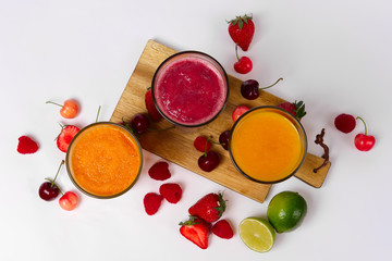 top view of three glasses with fruit smoothies