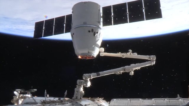 Low angle, satellite attached to International Space Station