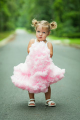 Pretty Preschool Blond Little Girl with Pigtails in Pink Skirt 
