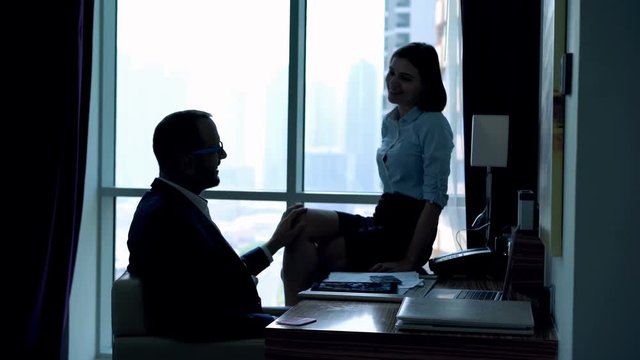 Young business couple are having office affair in the office, 4K
