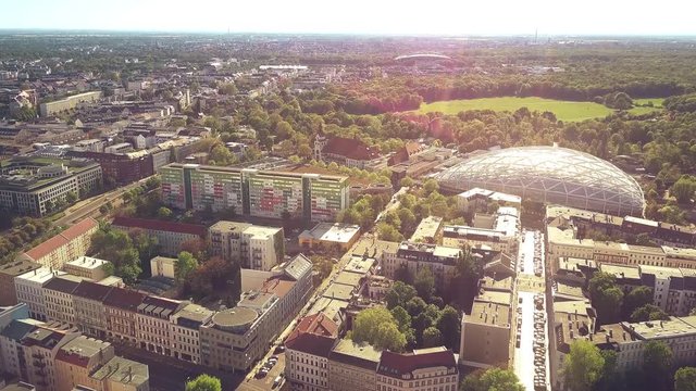 Aerial shot of Leipzig townscape involving modern glass roof of the city zoo
