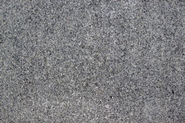 Marble or granite texture is used as a background. Abstract gray texture with many holes.