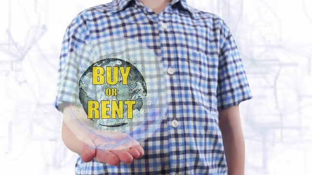 Young man shows a hologram of the planet Earth and text Buy or rent. Boy with future technology 3d projection on a modern white digital background