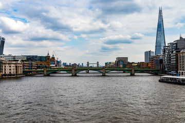 View from millennium bridge london with tower bridge and shards