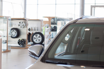 New cars at dealer showroom.